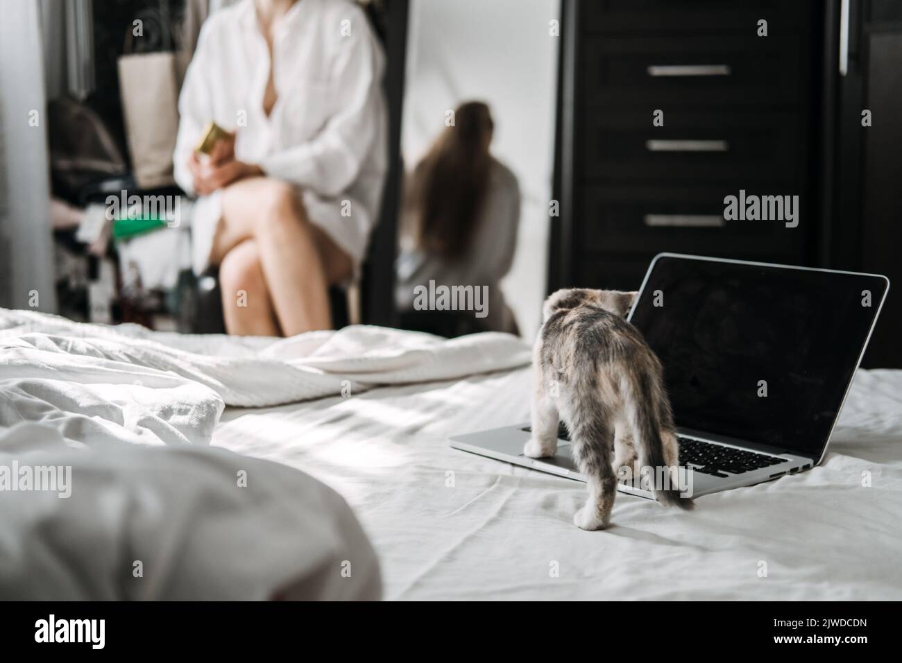 Self care, Mental health, mental wellbeing, calm, mourning routines, start day. No stress. Young woman in pajamas doing morning routines with little Stock Photo