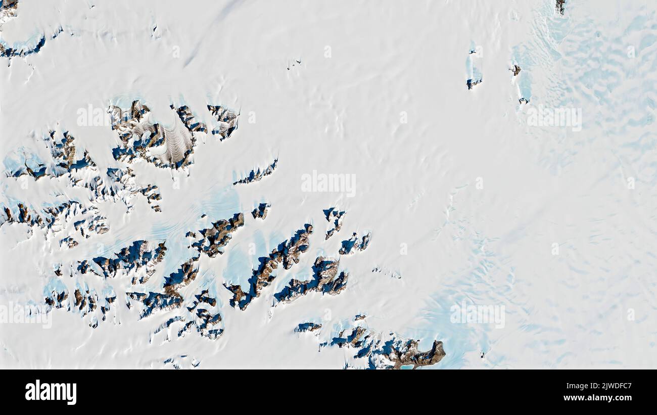 Antarctica Rocks Meteorite in Antarctica, top view of snow rock peaks background texture ...