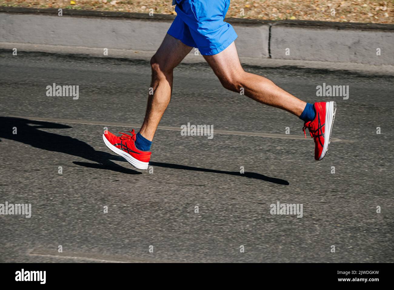 Ekaterinburg, Russia - August 7, 2022: athlete feet in running shoes Asics run in Europe-Asia Marathon Stock Photo