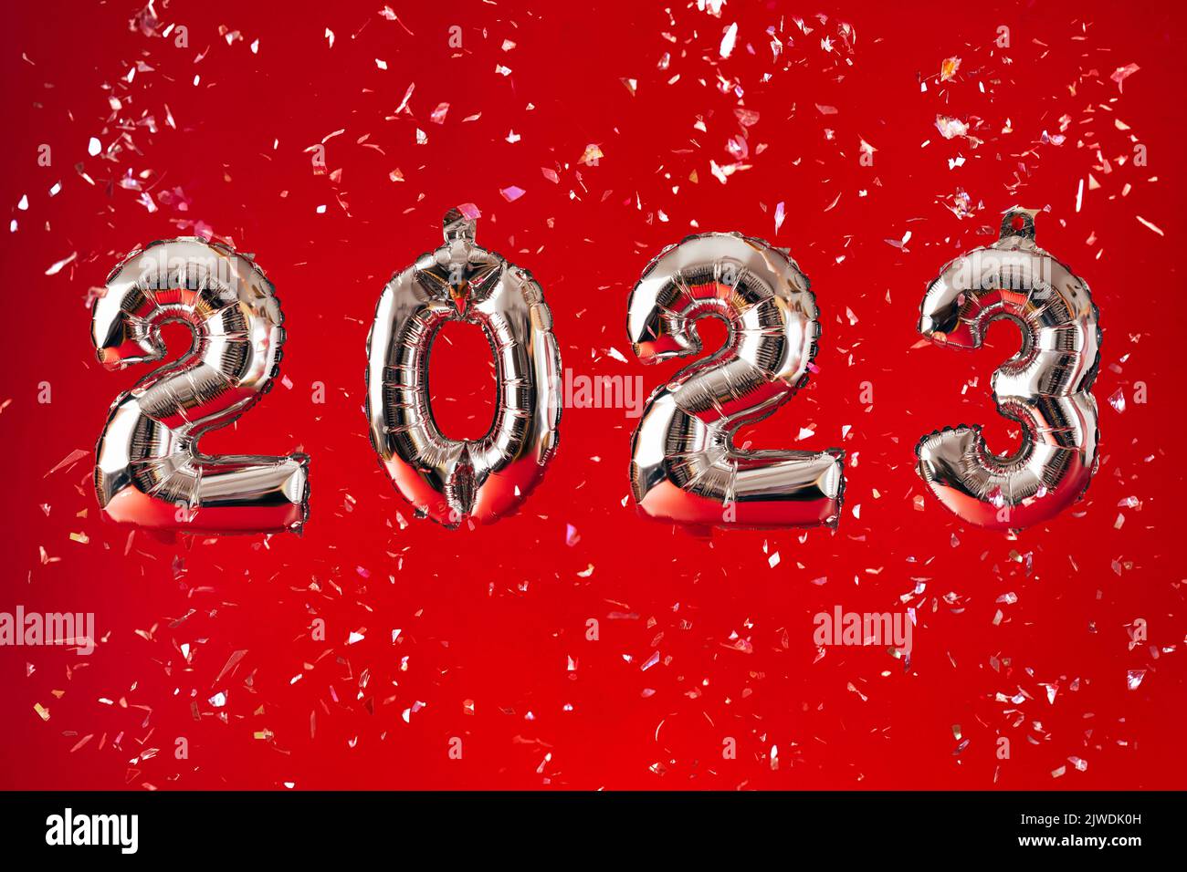 2023 New Year Celebration - silber numbers on bright red glitter background Stock Photo