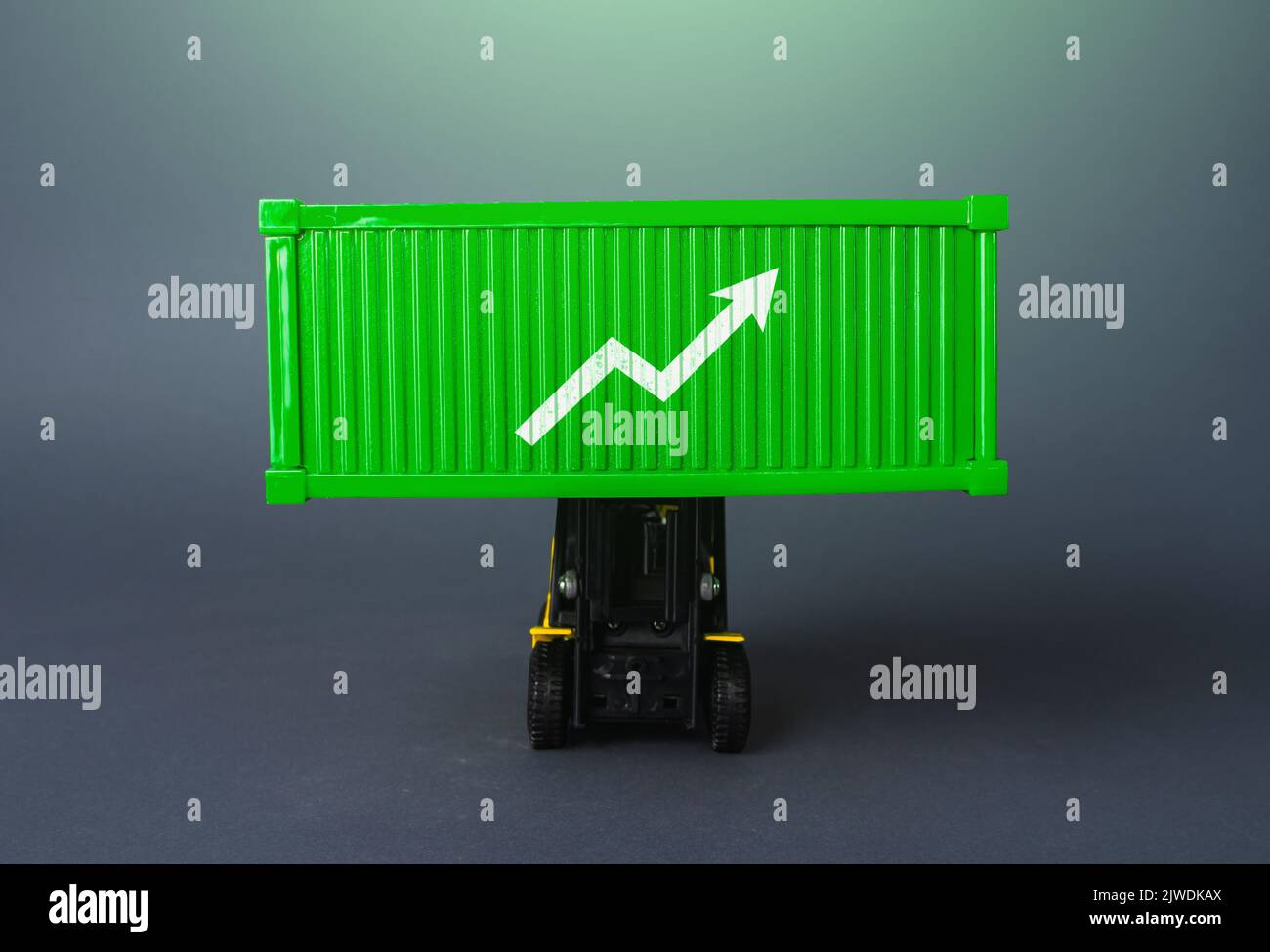 Green shipping container with up arrow. Increase in imports and exports of goods. Trade traffic increasing. Production rise. Growing transportation pr Stock Photo