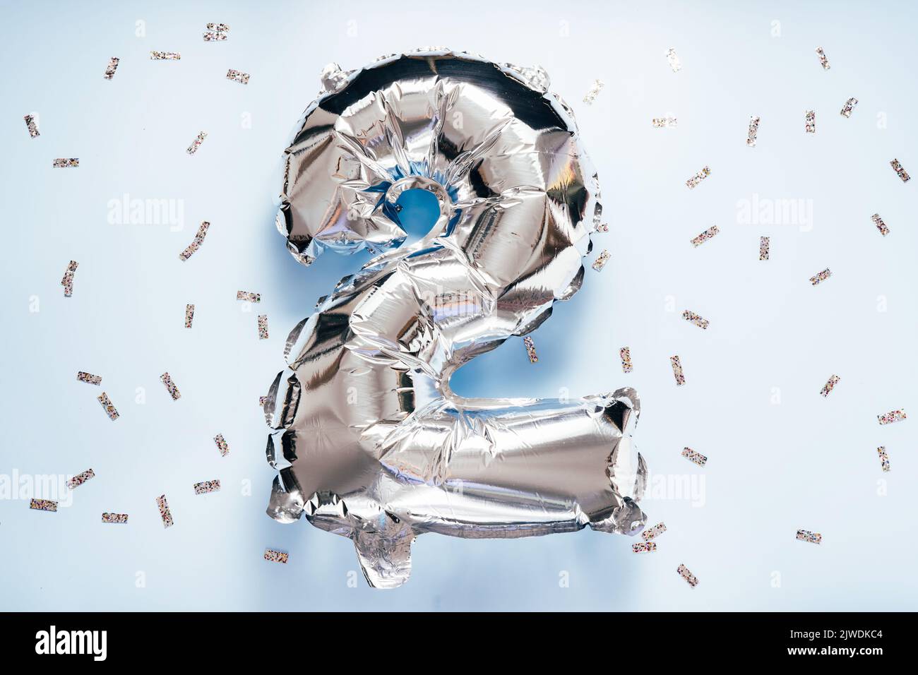 Silber balloon number 2 on light glitter background for your desing Stock Photo