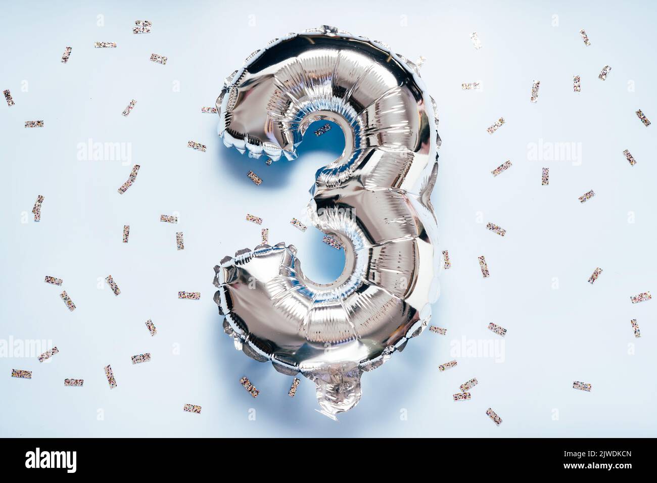 Silber balloon number 3 on light glitter background for your desing Stock Photo