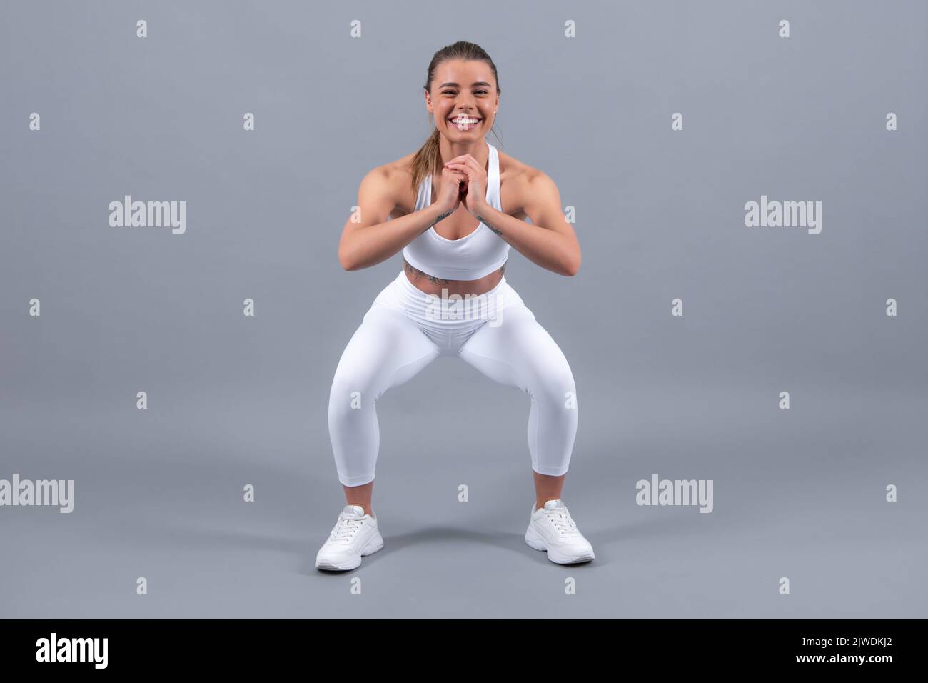 Closeup of Smiling Fitness Woman in White Sport Bra Holding Whole Roasted  Chicken on Tray and Dumbbell in Hand Stock Photo - Image of family, face:  202918104