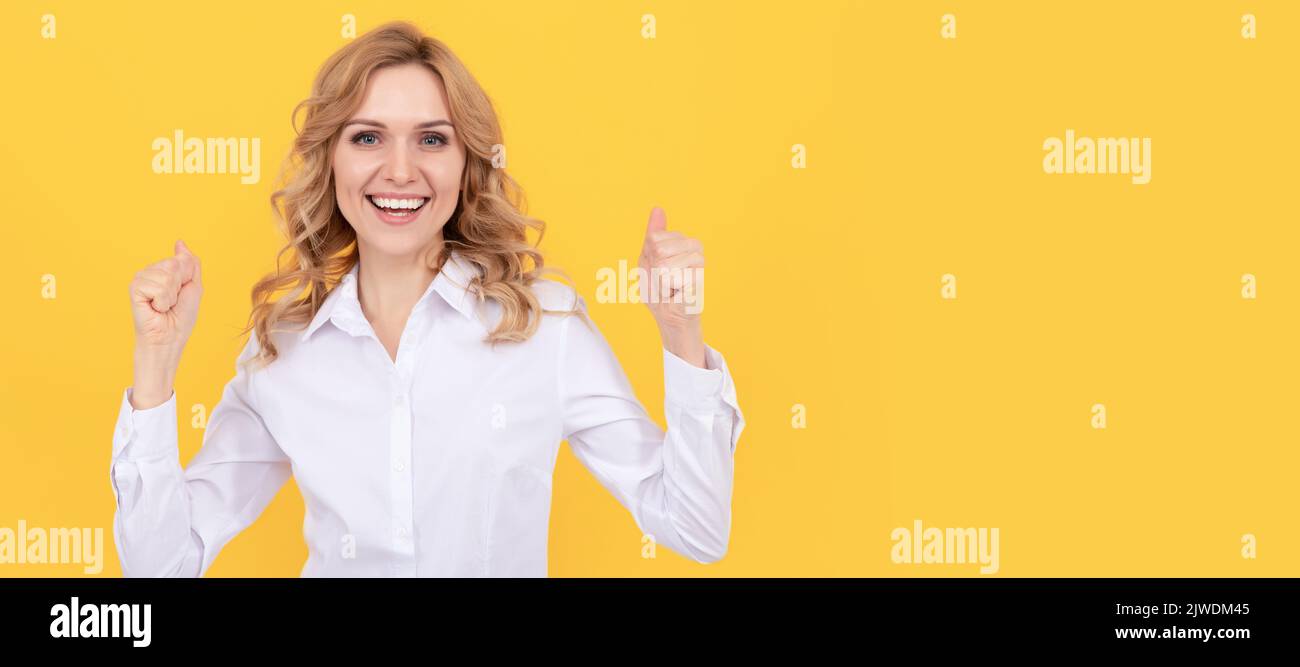 happy successful businesswoman woman in white shirt hold thumb up, success. Woman isolated face portrait, banner with mock up copy space. Stock Photo