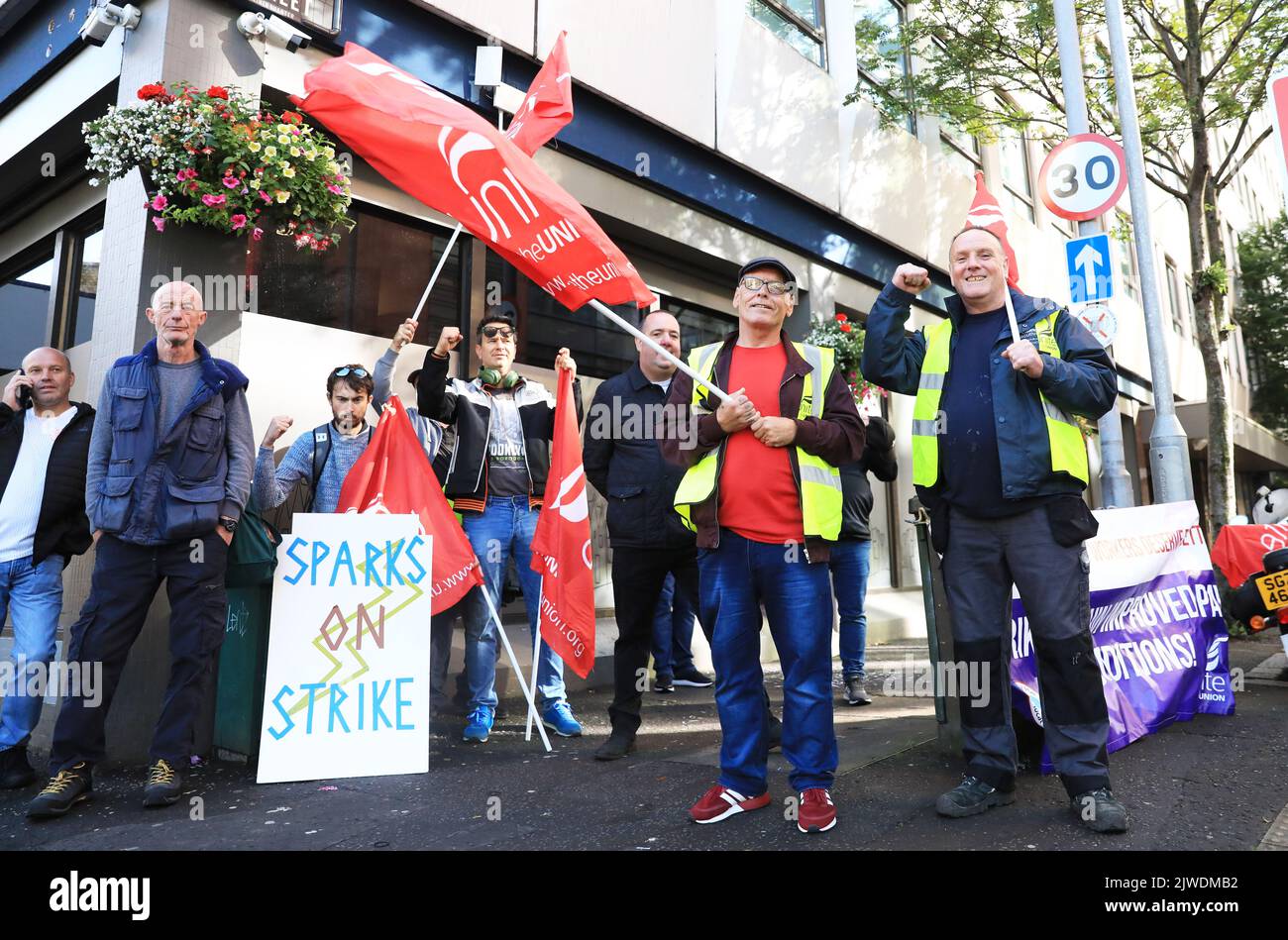 Workers from the Housing Executive picket outside their office in