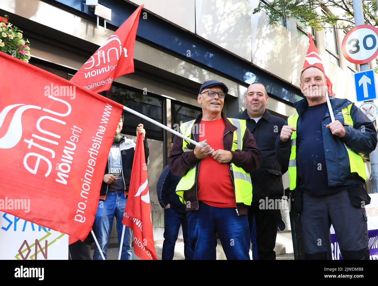 Workers from the Housing Executive picket outside their office in