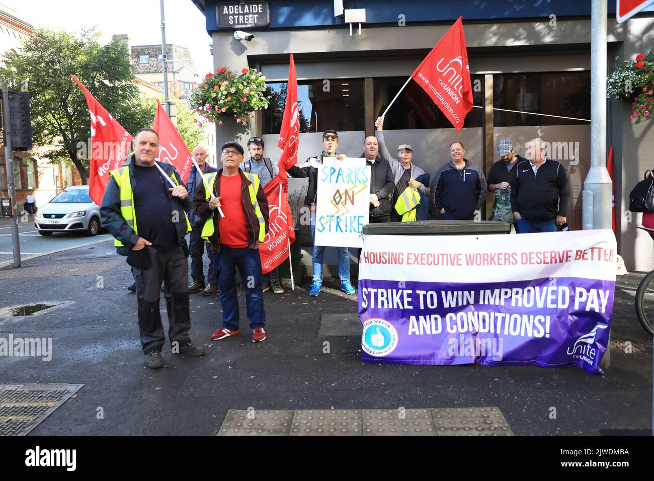 Workers from the Housing Executive picket outside their office in