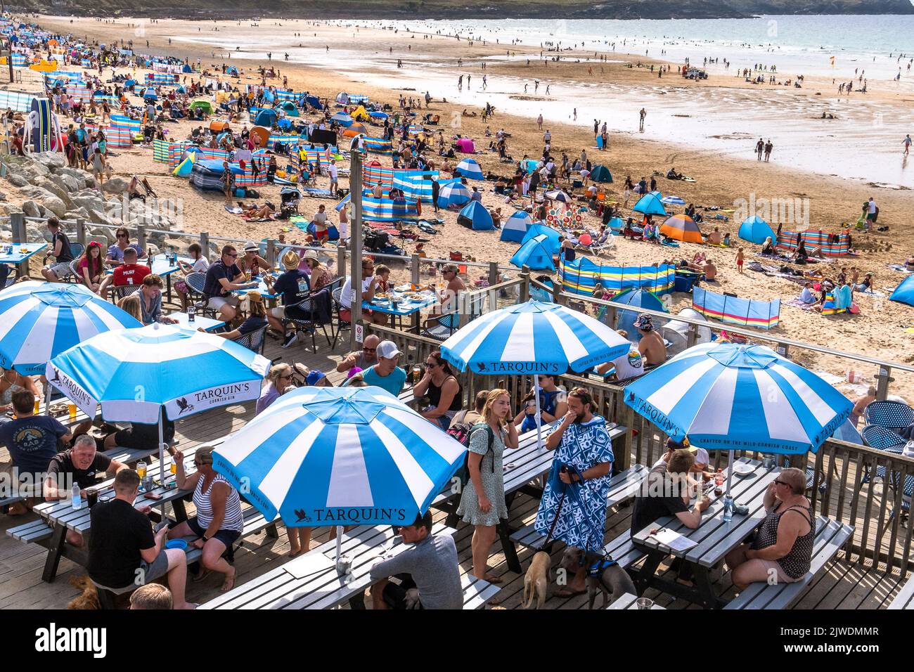 Holidaymakers on a busy crowded Fistral Beach in Newquay in Cornwall in the UK. Stock Photo