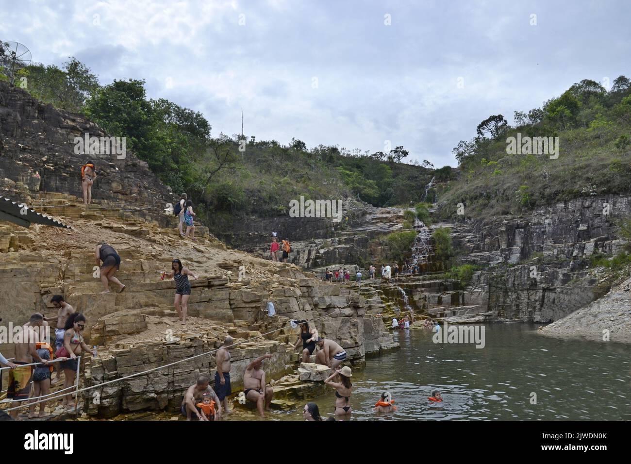 Tourists on the rocks and natural pool, Brazil, South America, panoramic view Stock Photo