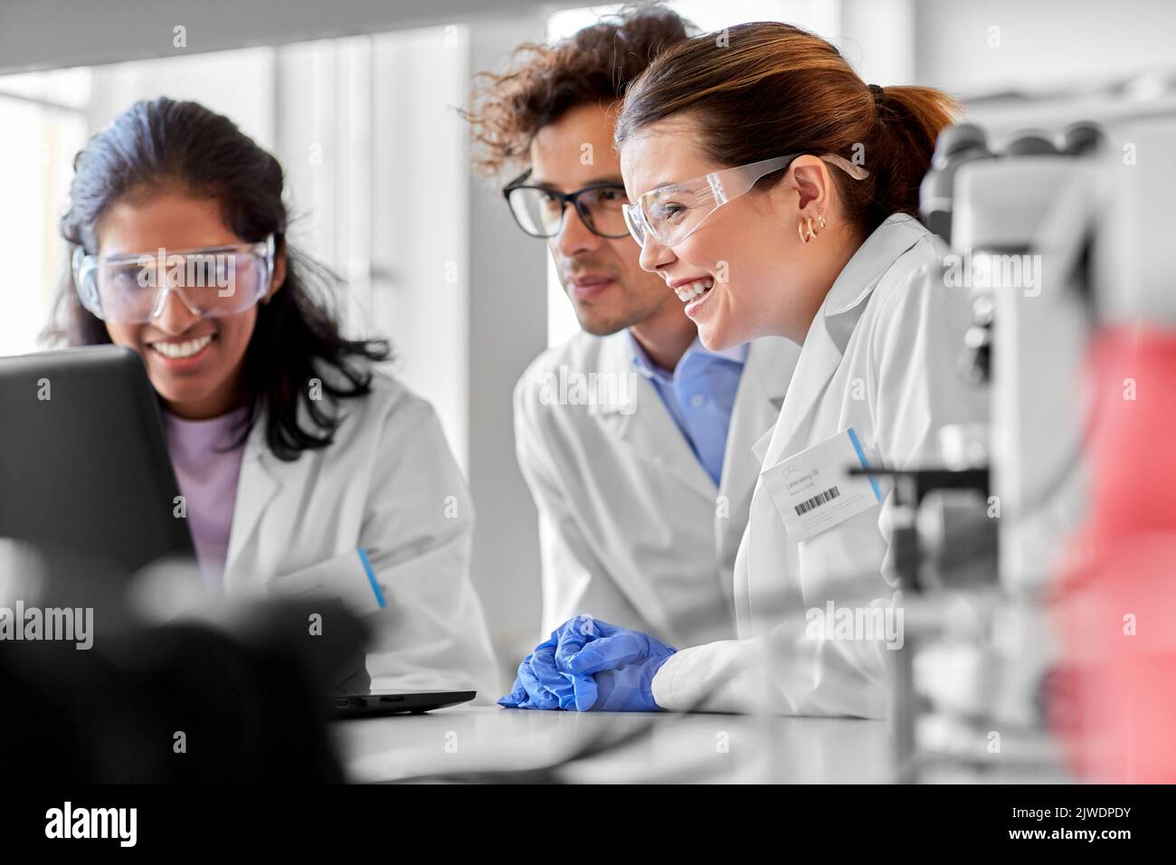 scientists with laptop working in laboratory Stock Photo