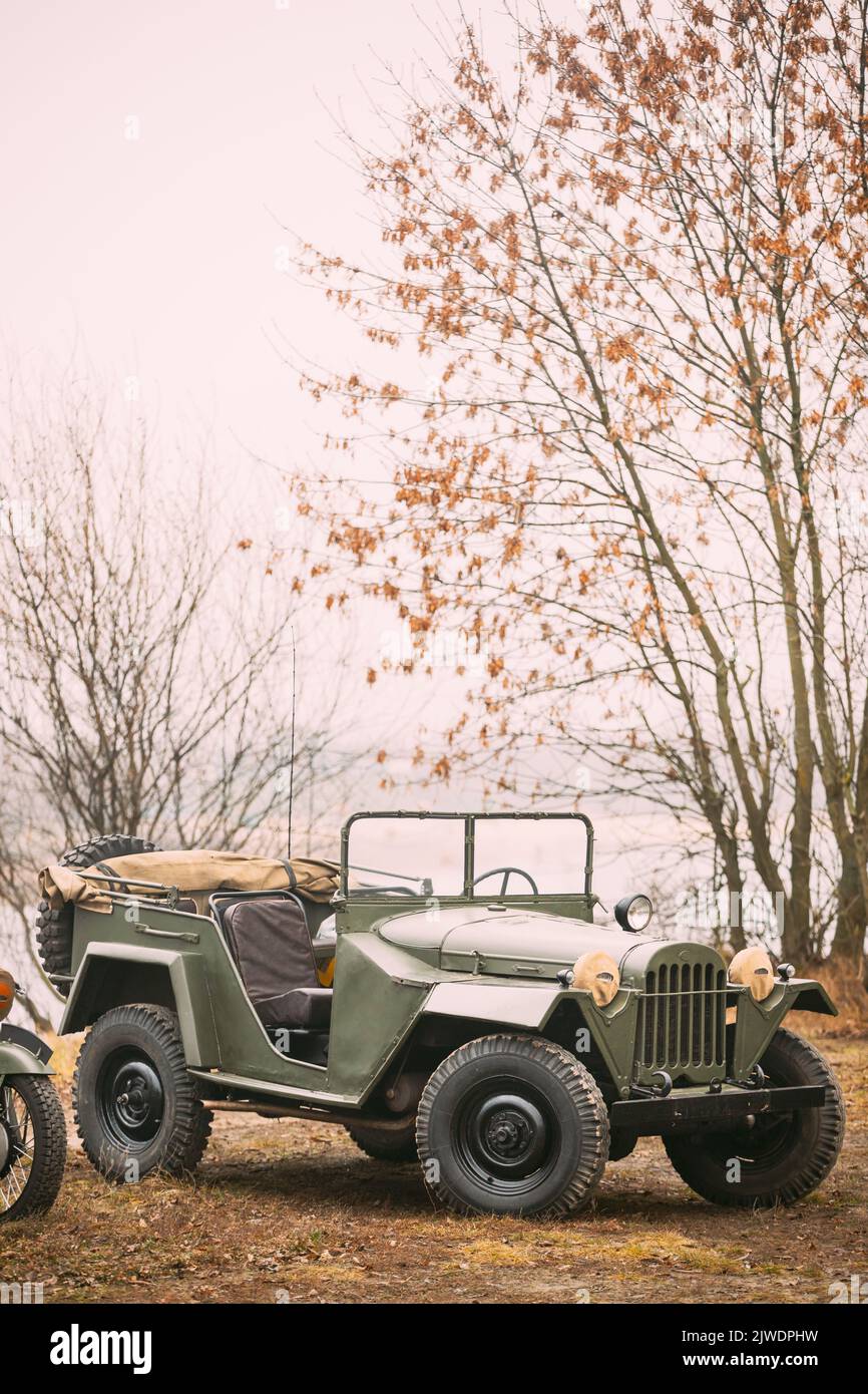 Willys Mb jeep, U.s. Army Truck, 4x4 Of Us Army Forces Of World War 2 Time Standing Parked At Forest During Reconstruction Of Some Fight World War II Stock Photo