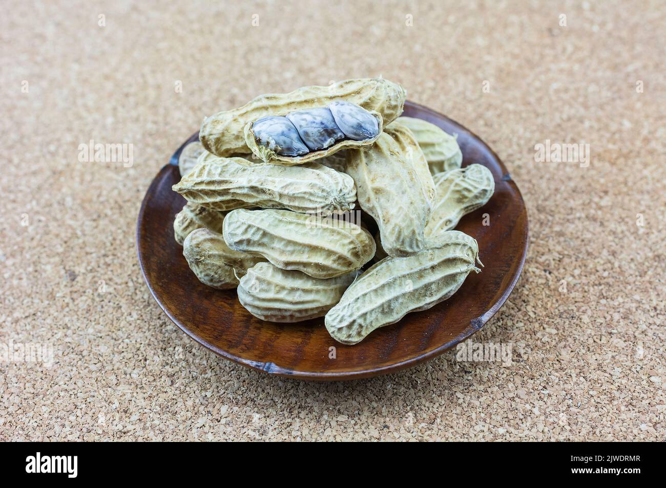 Peanuts peeled on a wooden floor Stock Photo Alamy