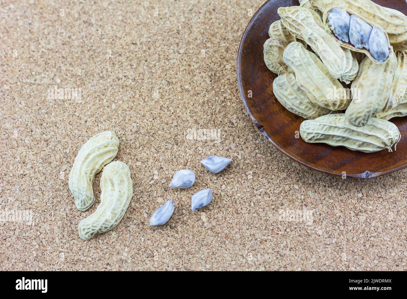 Peanuts peeled on a wooden floor Stock Photo Alamy