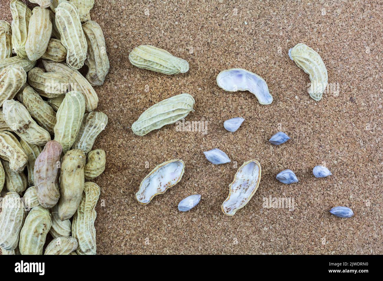 Peanuts peeled on a wooden floor Stock Photo Alamy