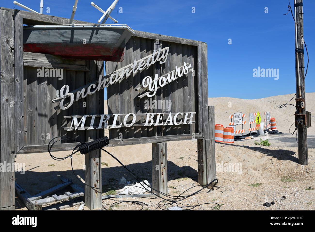 Mirlo Beach sign at Rodanthe greeted visitors for decades, faces an uncertain future with the removal of part of Rt 12 due to erosion and over wash. Stock Photo