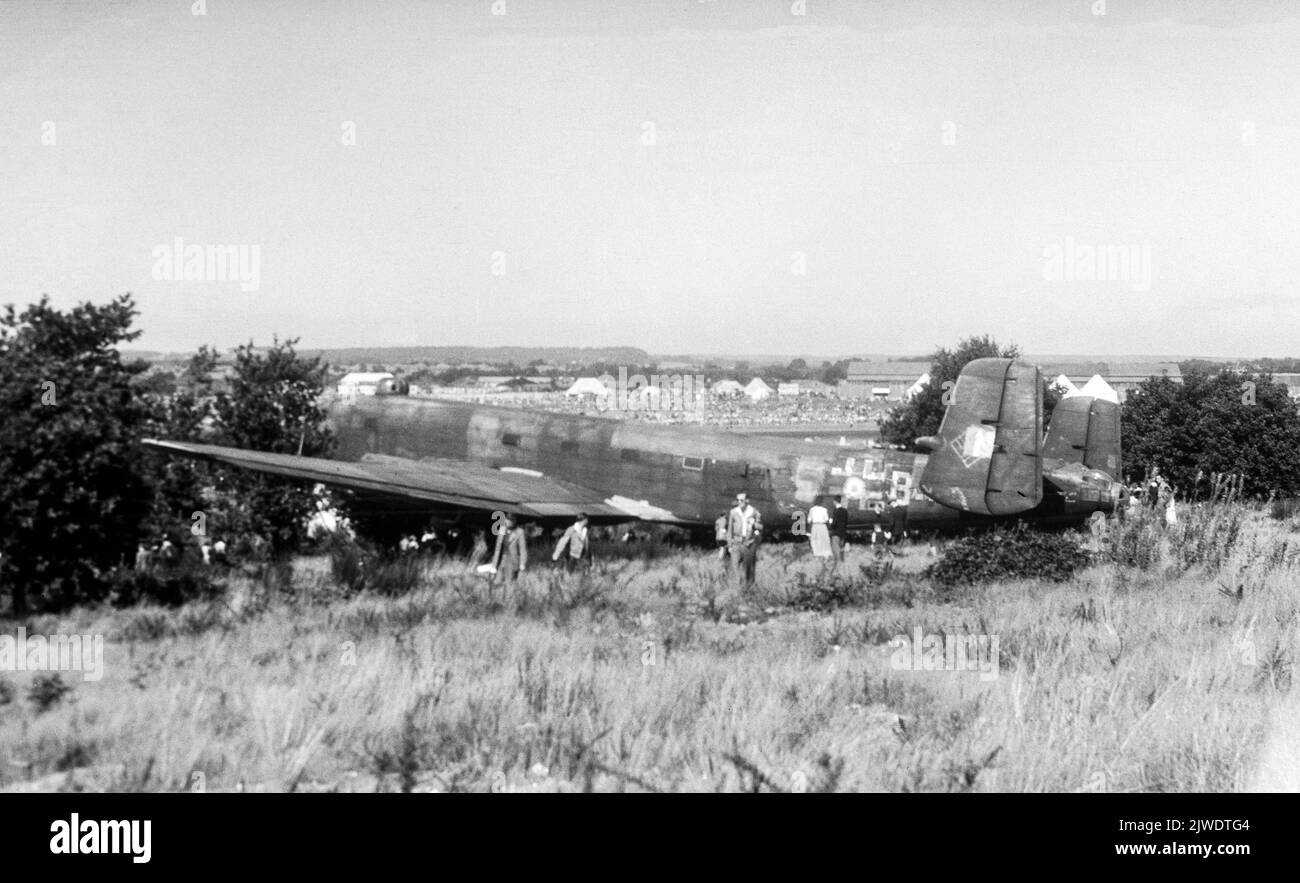 A vintage black and white photograph showing a German Air Force Luftwaffe Junker 290 Bomber which was captured by the allied forces during World War II. Photo taken in England just after the war. Stock Photo
