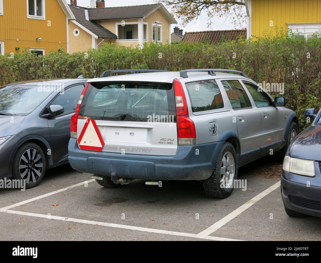 CONVERTED CARS marked with red triangel is registred as agricultural machines and can be driven by young people without a drivers license in 30 km/h.A swedish phenomenon that has grown in recent  years Stock Photo
