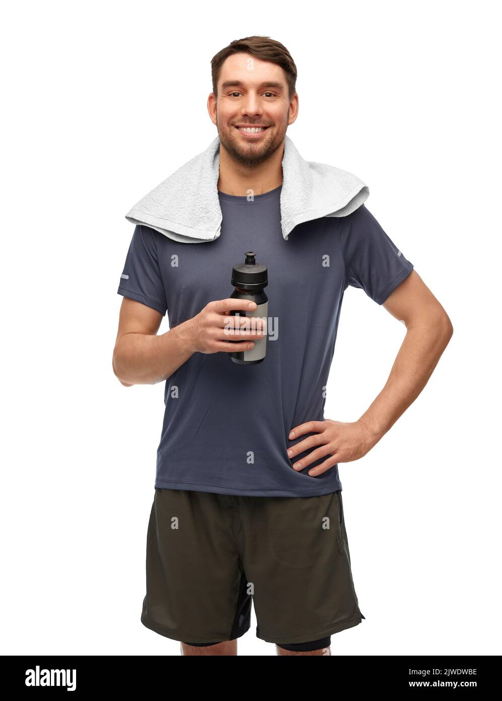 happy man in sports clothes with bottle and towel Stock Photo