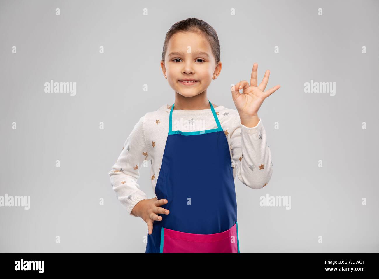 Girl in apron hi-res stock photography and images - Alamy