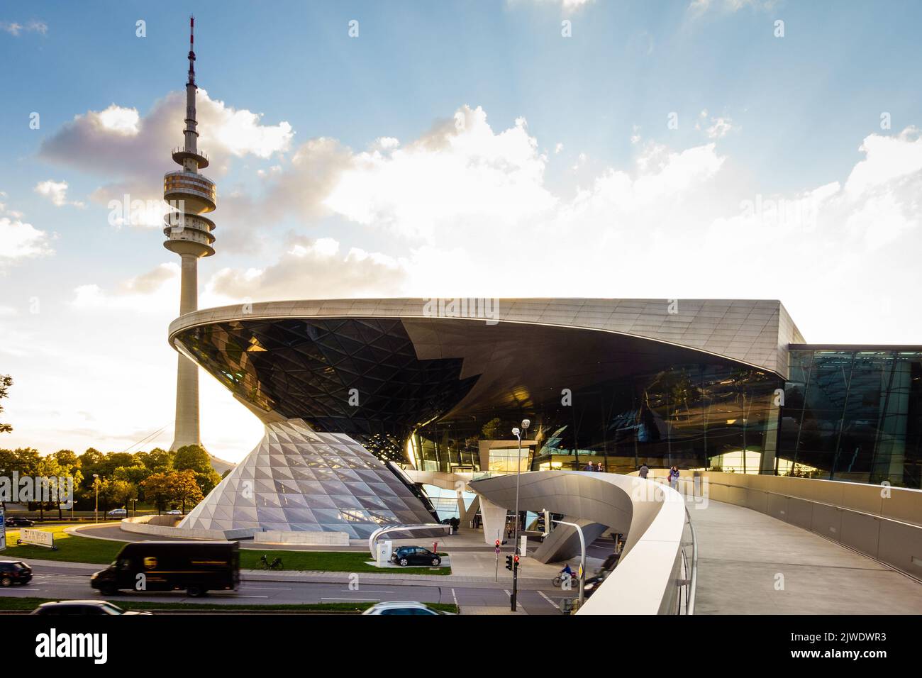 Munich, Germany, September 29, 2015: BMW showroom with Olympic television tower in the background in Munich, Germany Stock Photo