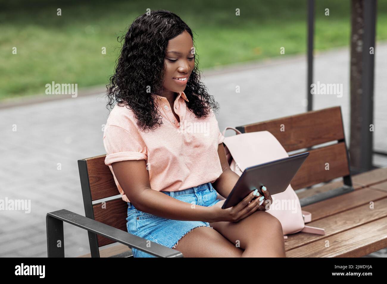 african american woman with tablet pc in city Stock Photo