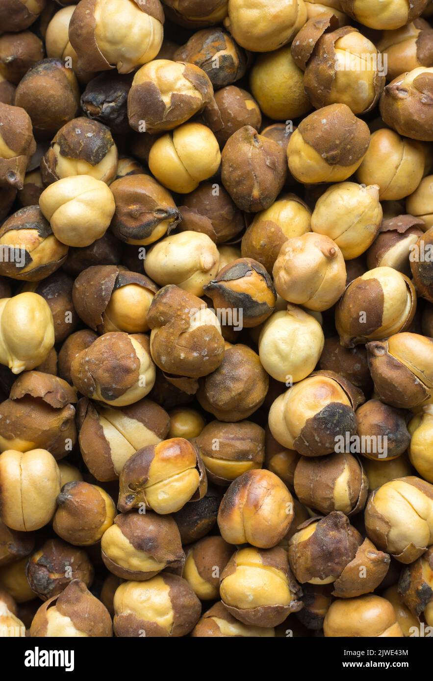 close-up of roasted and salted black chickpeas, also known as bengal gram or desi chickpea, traditional and native oil free snack of india, macro food Stock Photo