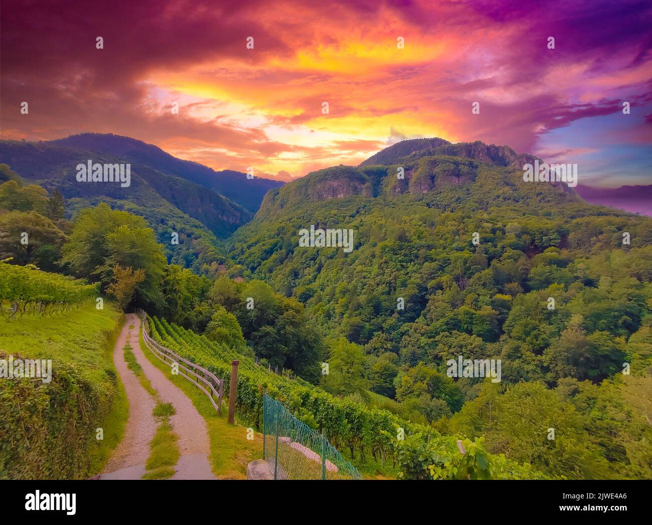 Landscape of mountains at sunset in summer with dramatic sky Stock Photo
