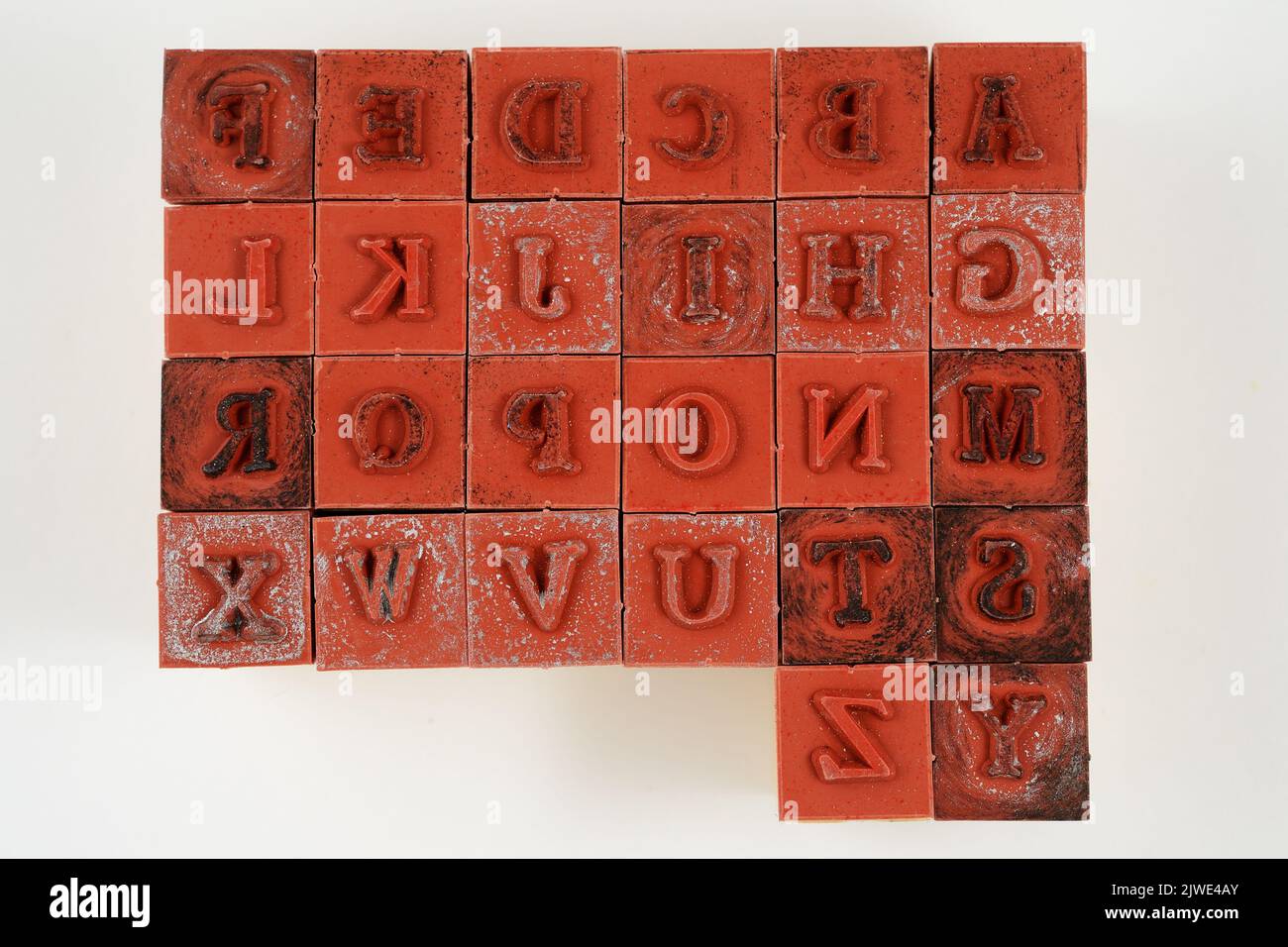 rubber stamps of letters of the Latin alphabet on a neutral background Stock Photo