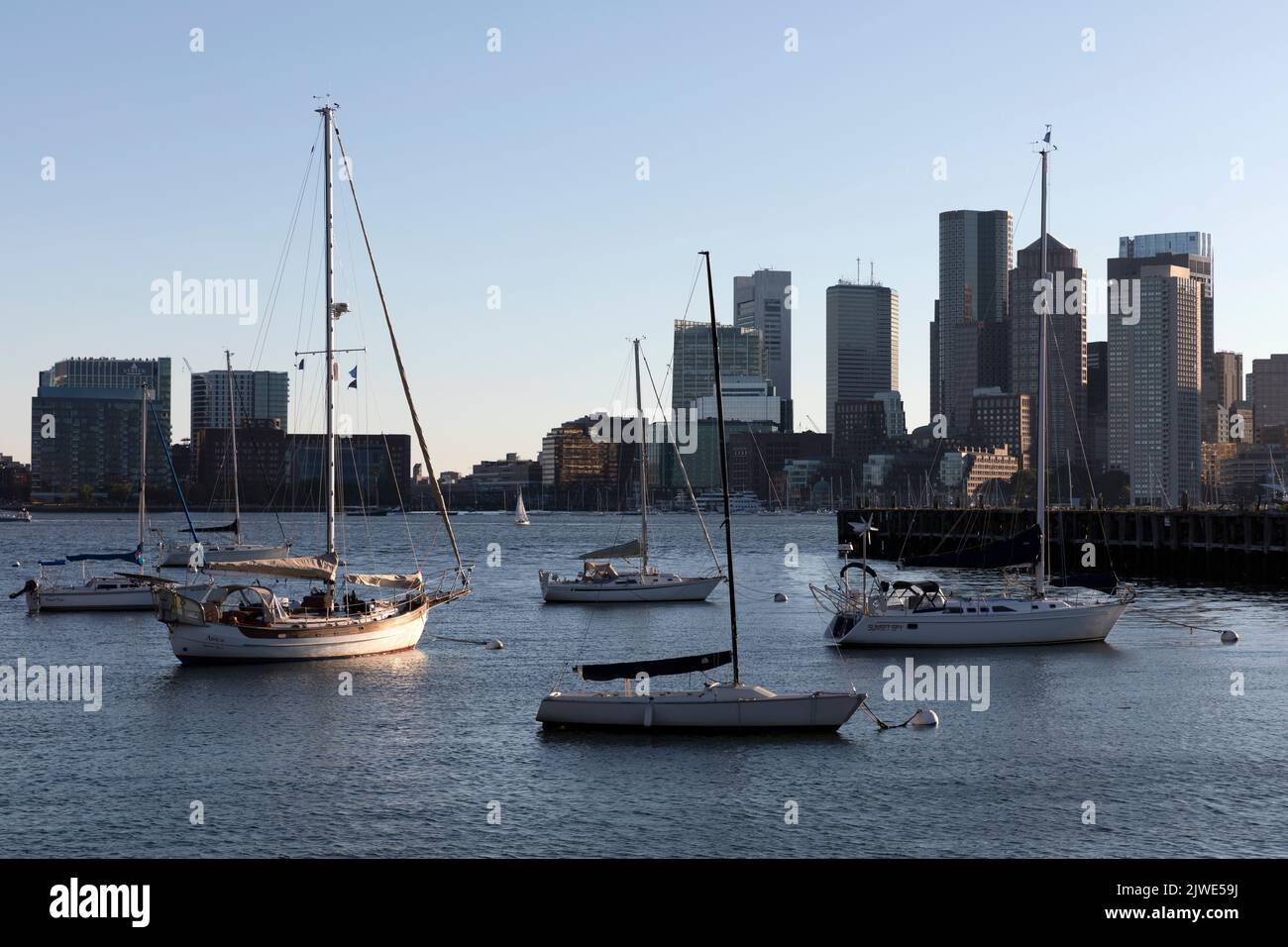 Boats moored Boston Harbor skyline, Massachusetts USA Stock Photo