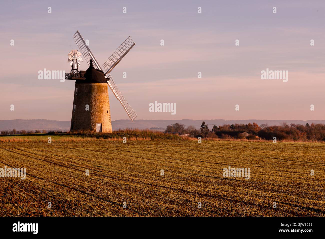 The sunset behind the old windmill at Little Milton, Oxfordshire Stock