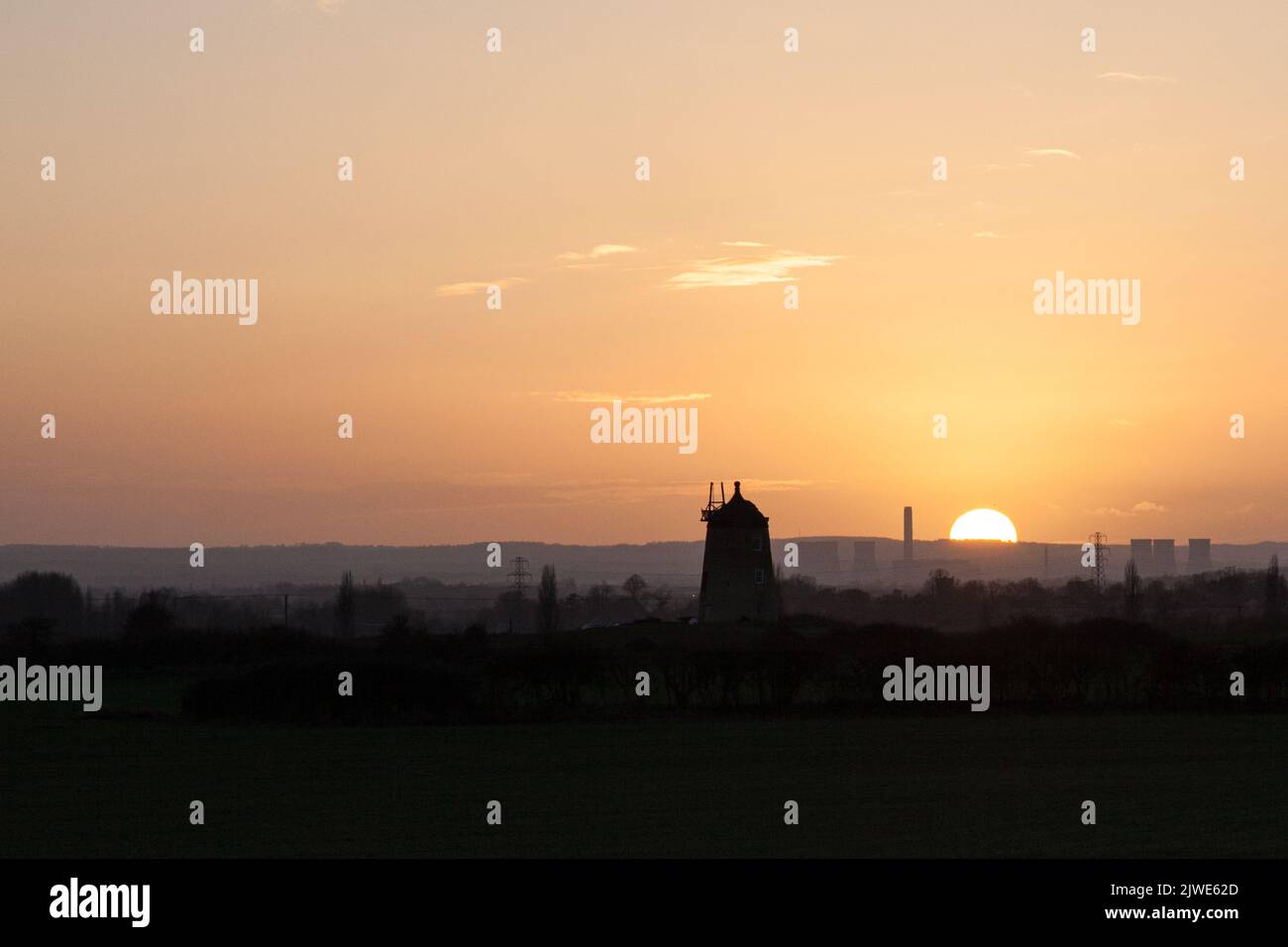 The sunset behind the old windmill at Little Milton, Oxfordshire Stock