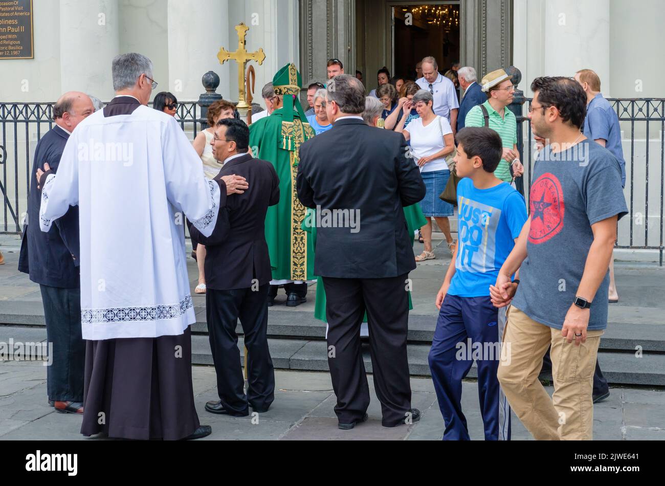 NEW ORLEANS, LA, USA - JULY 16, 2017: Bishop greets parishioners after mass outside St. Louis Cathedral in the French Quarter Stock Photo