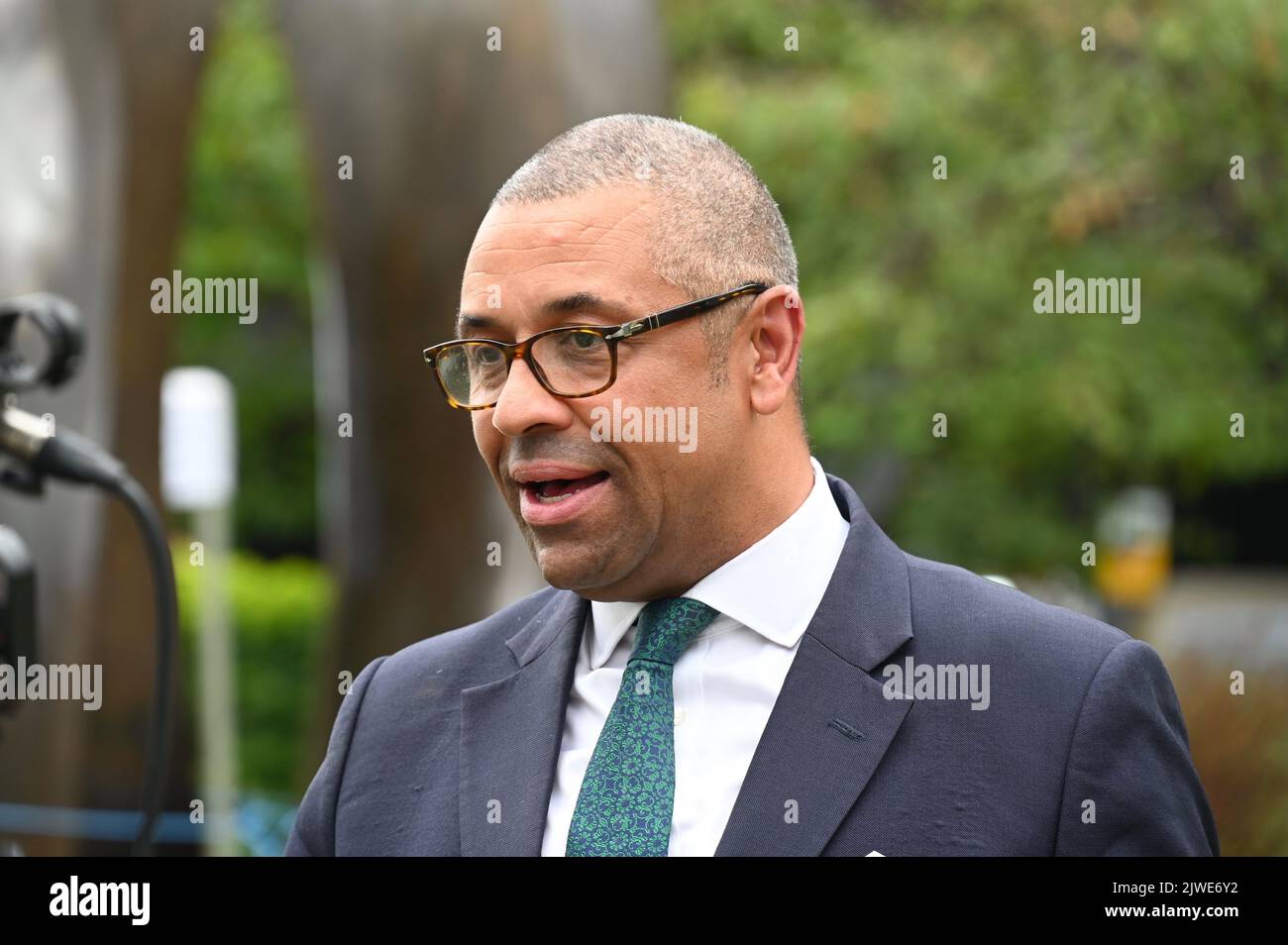 London, UK. James Cleverly. Politicians and news presenters gathered on College Green opposite the Houses of Parliament to discuss the Conservative Leadership Announcement. Stock Photo