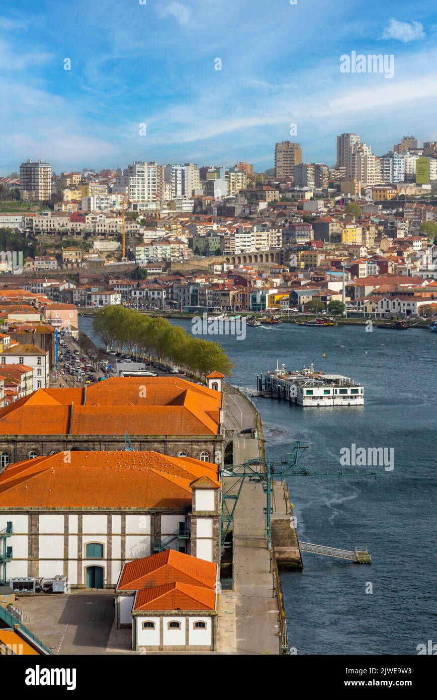 Tourist sightseeing boat sailing on the River Douro in the centre of Porto a major city in northern Portugal. Stock Photo
