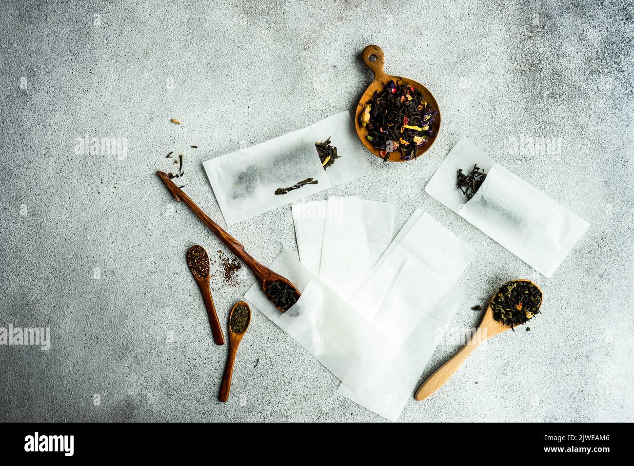 Overhead view of wooden spoons with assorted teas and single use tea bags Stock Photo Alamy