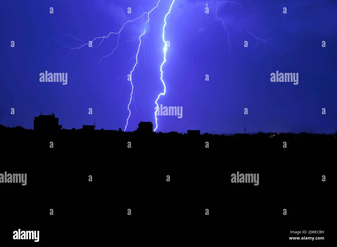 Lightning in the night sky above the city Stock Photo - Alamy