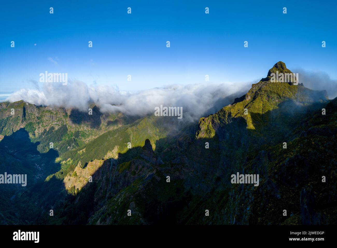Aerial view of mountain range and mountain peaks above clouds, Madeira, Portugal Stock Photo