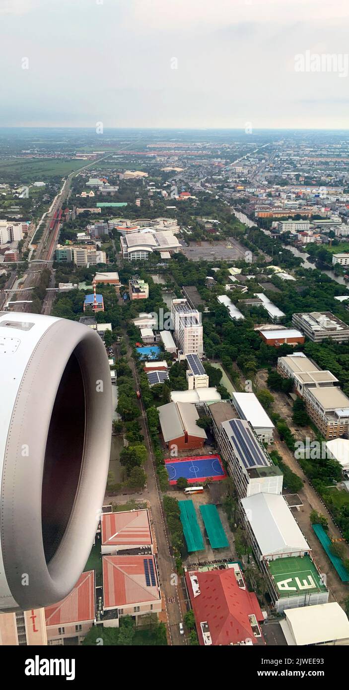 Aerial view of a plane flying into Bangkok, Thailand Stock Photo
