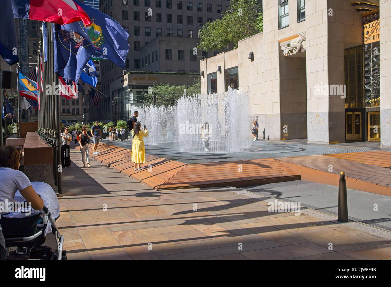 New York, NY, USA - Sept 5, 2022: Rockefeller Center fountain allows you to stay dry if you enter and stand still in an instant when the fountain disa Stock Photo