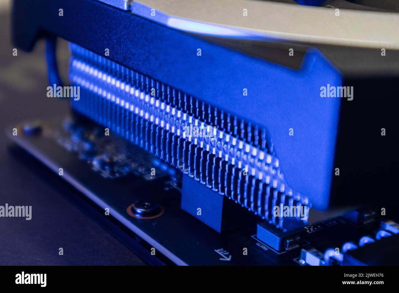 Gpu graphics or video card cooling system close-up in blue light with blur, PC hardware electronics details. Components from powerful computer for gam Stock Photo