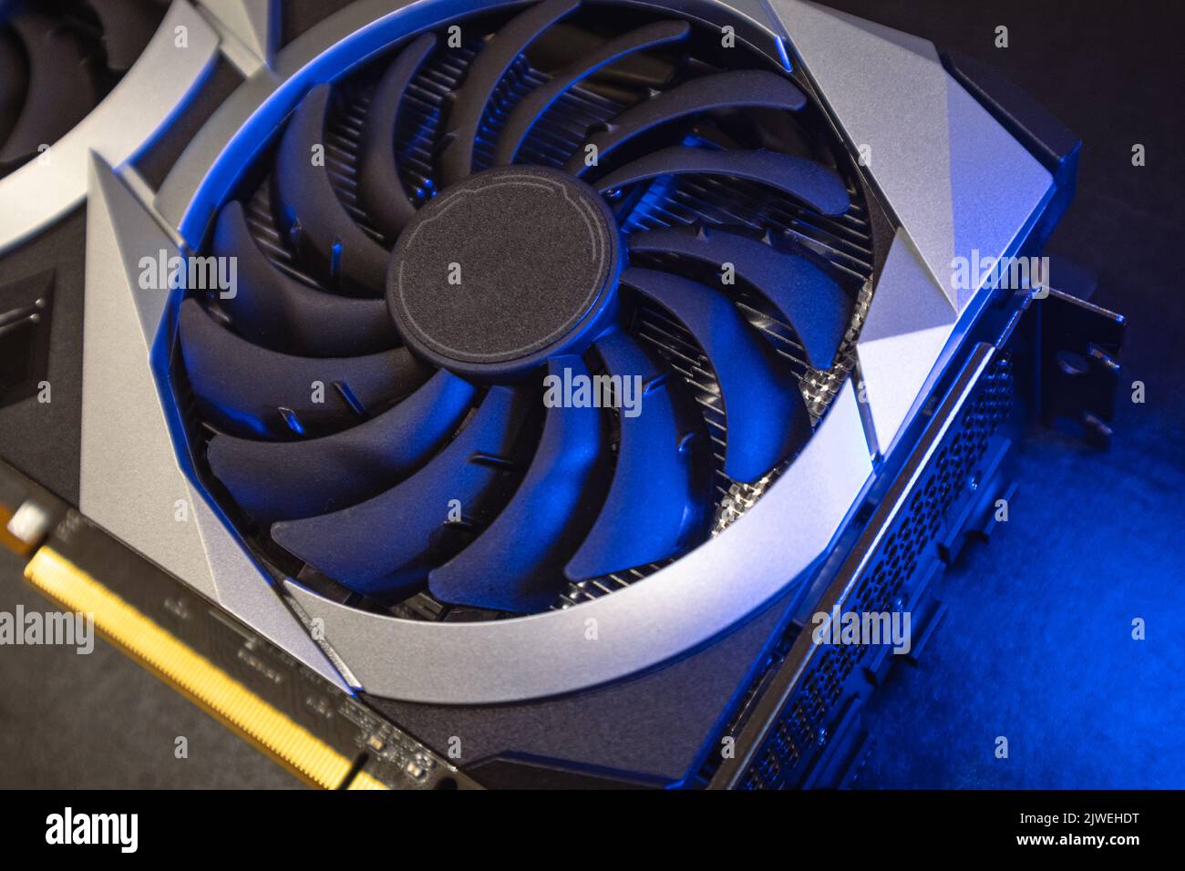 Gpu graphics card fan top view. Cooler fan closeup in bright blue