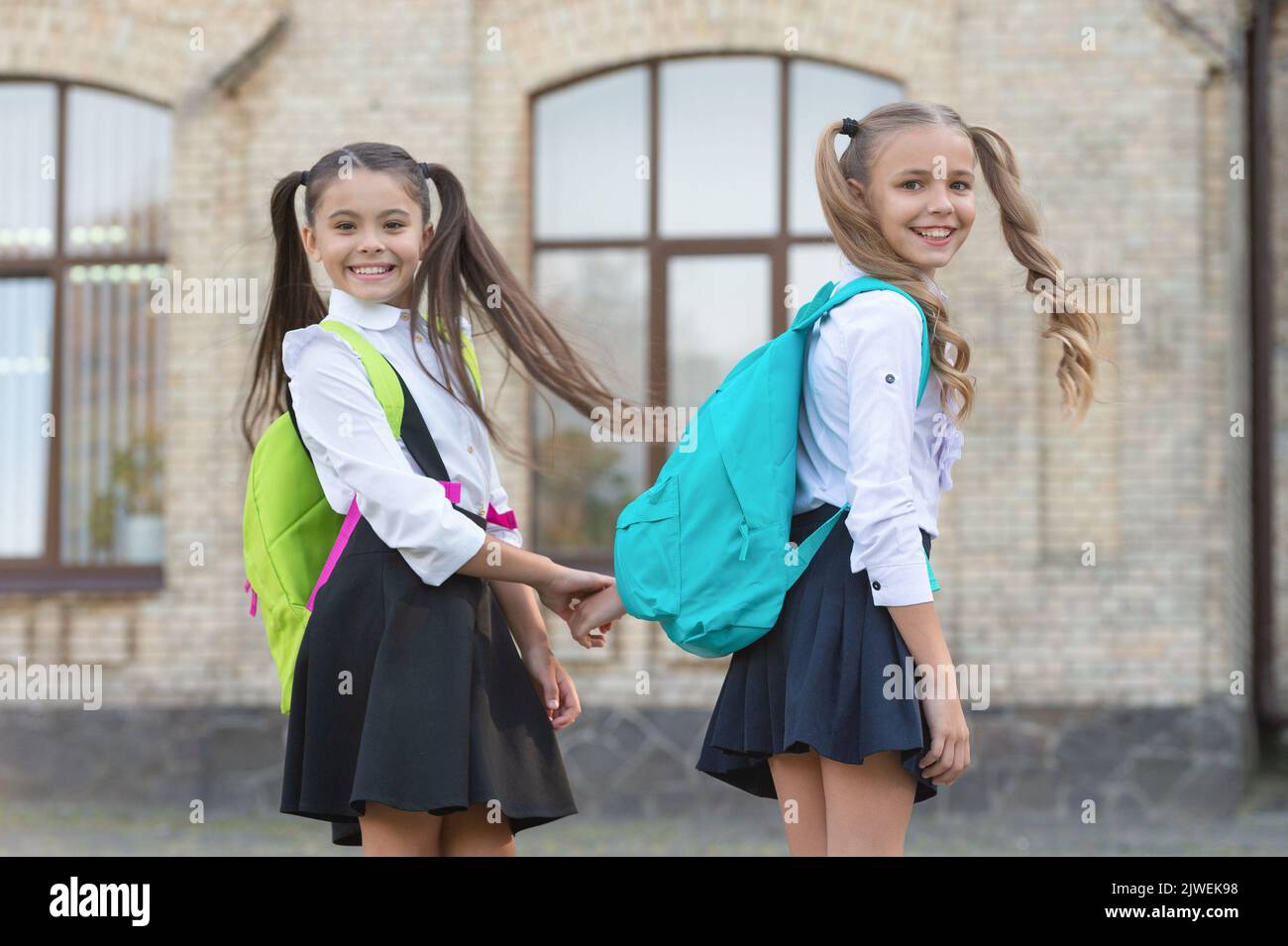 happy two school girls best friends together outdoor Stock Photo Alamy