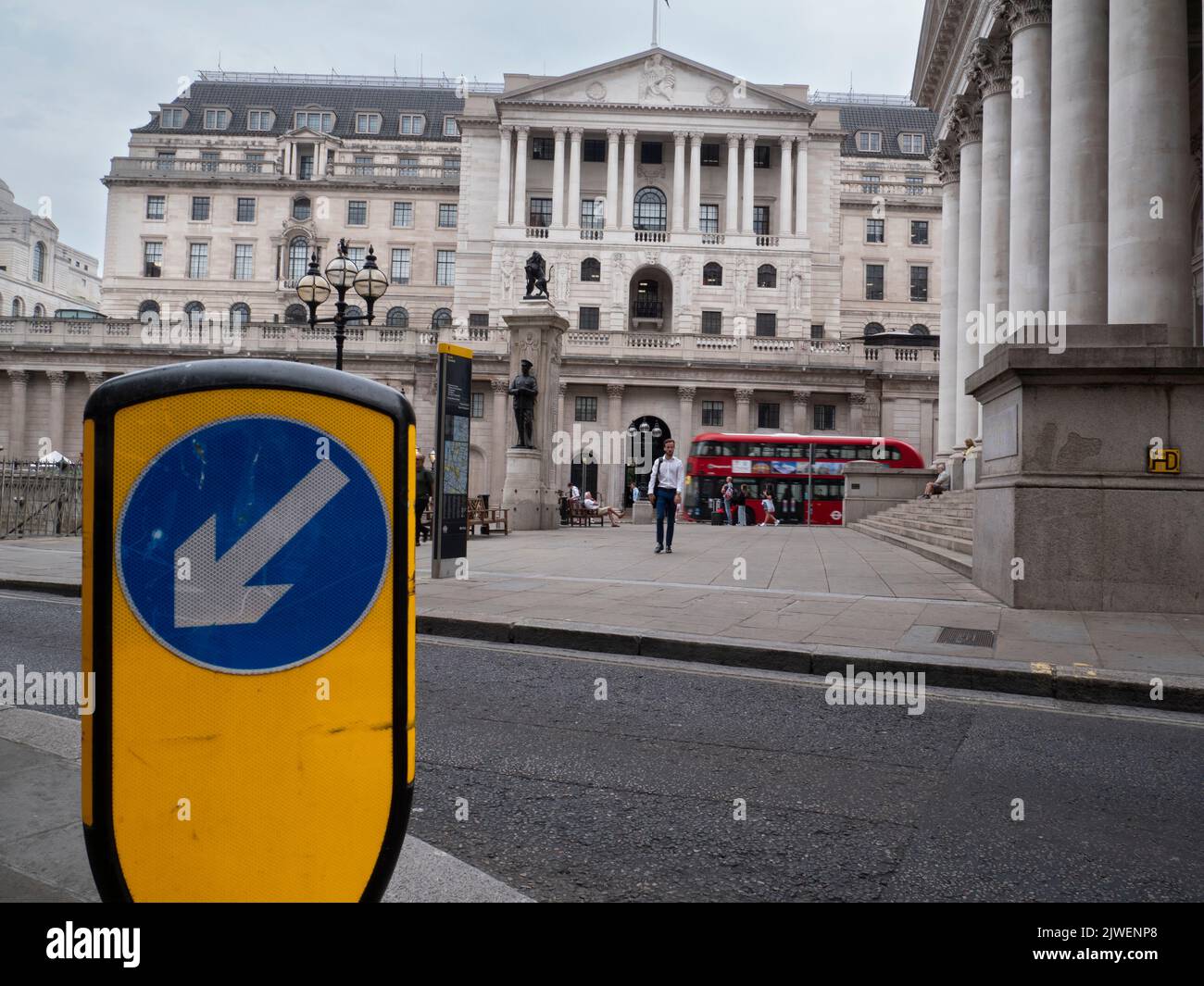 City of London UK. Bank of England building Threadneedle Street London with keep left sign in road Stock Photo