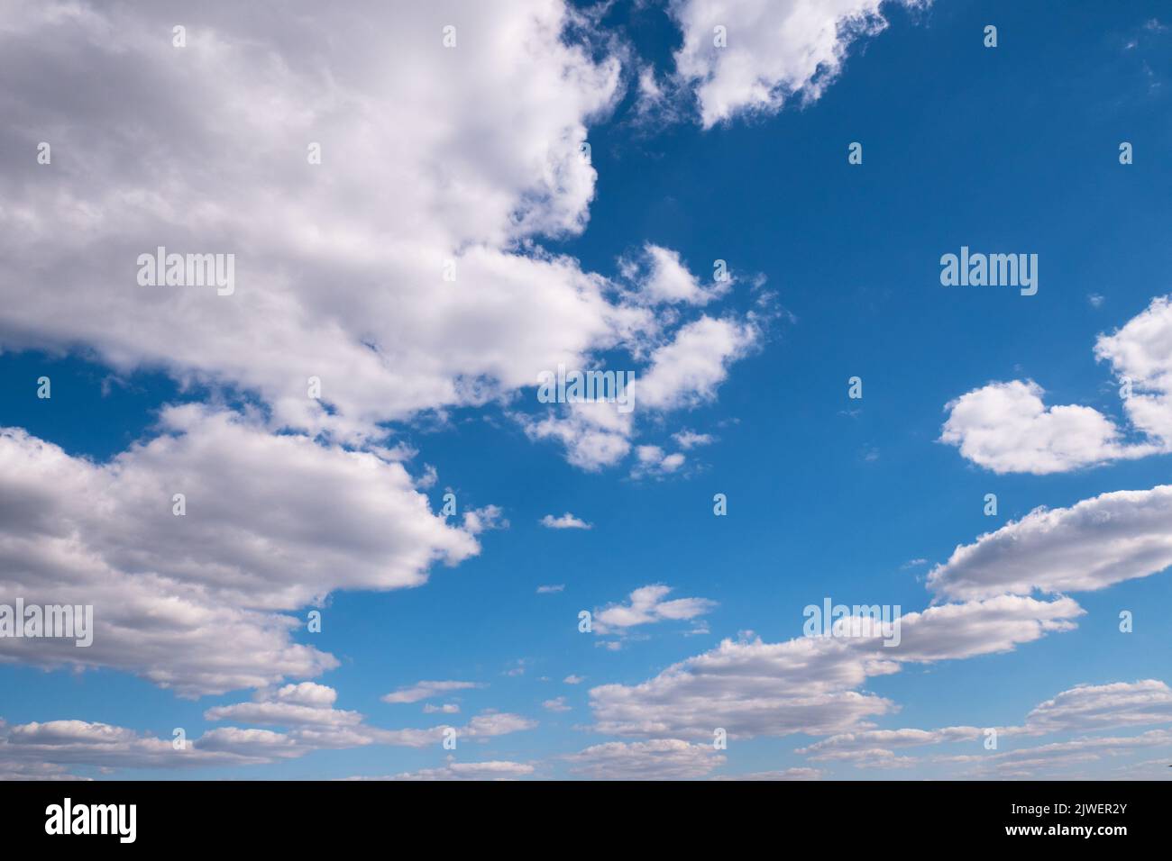 floating white clouds in the blue sky Stock Photo - Alamy