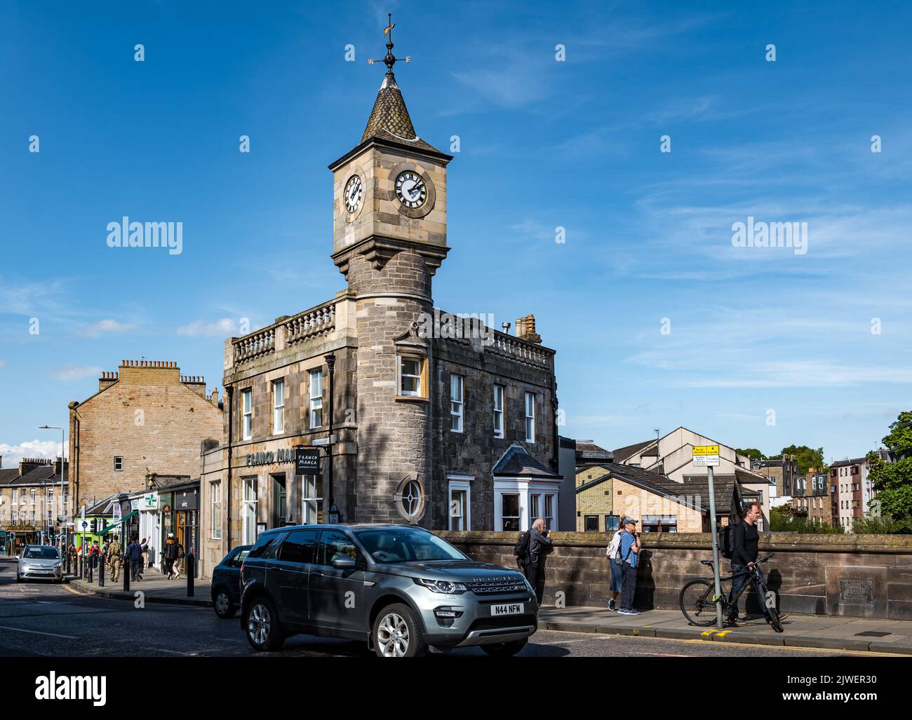 Clock tower on old Victorian building, former bank now a restaurant, Stockbridge, Edinburgh, Scotland, UK Stock Photo
