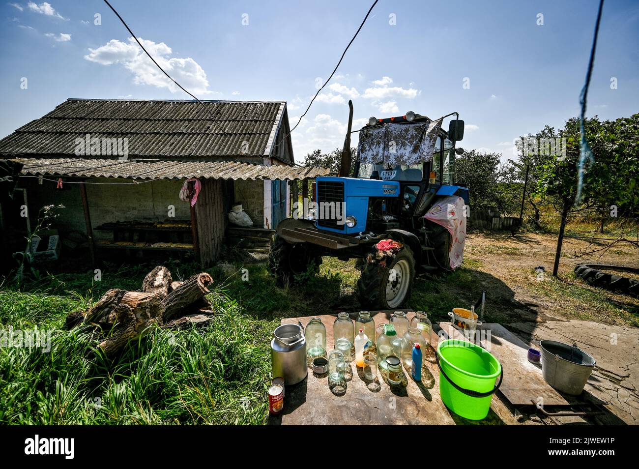 KOMAR, UKRAINE - AUGUST 30, 2022 - A tractor is seen on the premises of ...