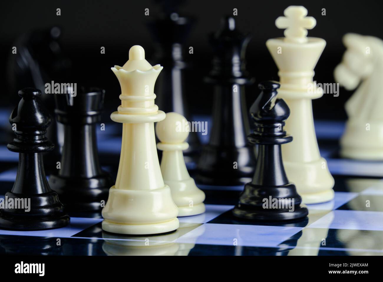 Black and white chess pieces on chess board Stock Photo
