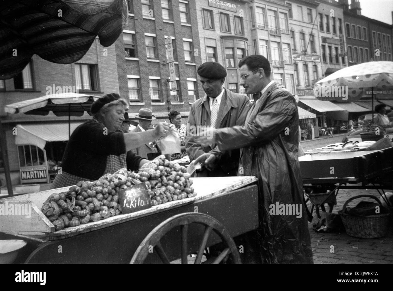 Seafood stall market trader woman on street market, Ostend, Belgium 1934 Stock Photo