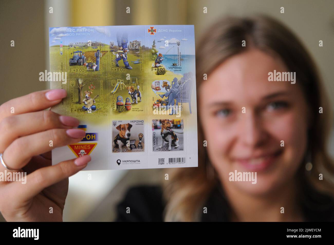 Lviv, Ukraine. 01st Sep, 2022. Woman shows a stamp during presentation
